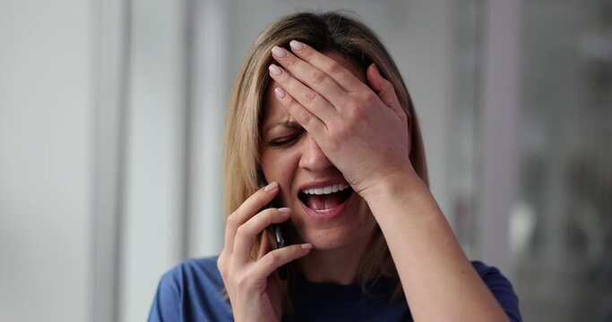 Woman talks on phone expressing regret about being late