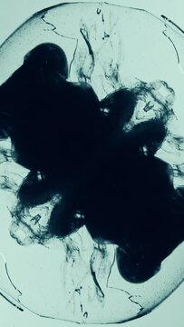 Vertical ink shot in water fractal graphic smoke
