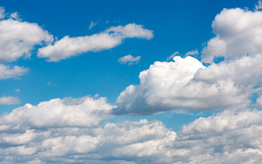 blue sky background with cumulus clouds