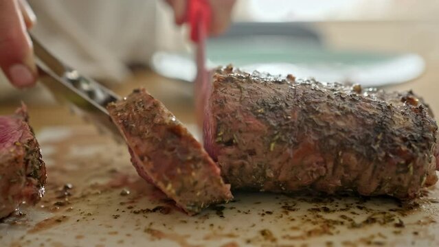 Mouth-Watering Scene - Perfectly Cooked Rack Of Lamb Is Sliced To Reveal Its Perfection