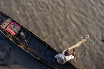 Fishermen at the Magdalena river in Malecon of Barranquilla