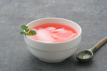 Es Kelapa Muda or young coconut ice with syrup
