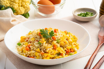 Cauliflower fried rice,Stir fried cauliflower rice with eggs ,carrot ,bean and corn in white...