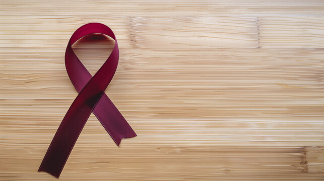 Burgundy cancer ribbon timber background support multiple myeloma, antiphospholipid syndrome, amyloidosis sickle cell disease meningitis awareness brain research copy space header medicine