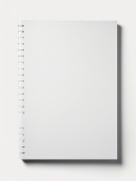 A white spiral notebook with no writing on it