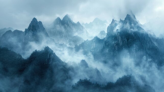 Enigmatic Peaks Amidst Mountain Mist Mystic mountain ridges loom through swirling mists, a tableau of nature's enigmatic grandeur in shades of blue and gray.