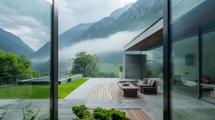 Summer terrace under the roof of a modern house There are mountains behind. foggy 
