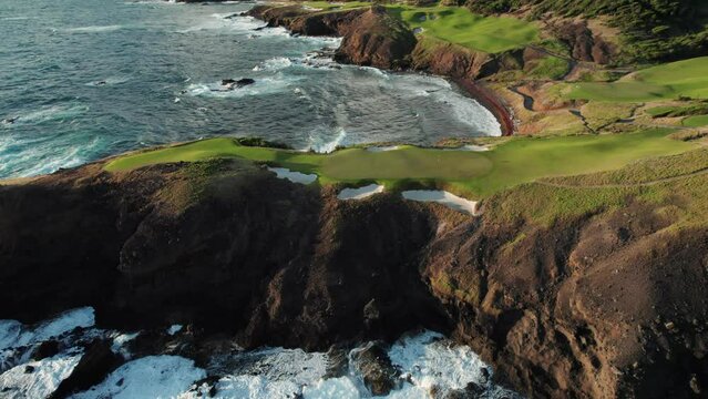Aerial footage of Saint Lucia, Caribbean island, with Golf course on a steep rocky cliff