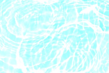 Bluewater waves on the surface ripples blurred. Defocus blurred transparent blue colored clear calm water surface texture with splash and bubbles. Water waves with shining pattern texture background.