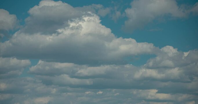 High dynamic range white clouds drifting timelapse, sunny day with blue sky