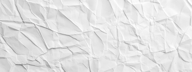Discover the subtle beauty of a white crumpled paper texture, offering a high-resolution background with detailed creases and wrinkles, perfect for artistic and design purposes.