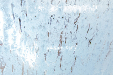 Car glass at a car wash In drops of water. Background