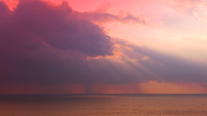 Sunbeam sky scene over the ocean  with Twilight in the Evening as the colors of Sunset Horizon scene