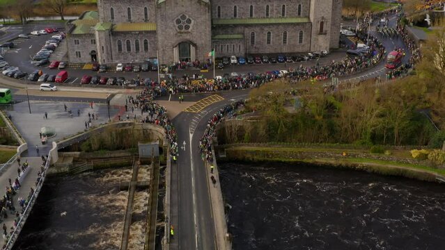 People At St. Patrick's Day Festival In Galway, Ireland. aerial tilt-down