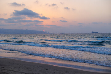 Sunset on a beautiful beach. Sandy beach in Haifa, Israel.