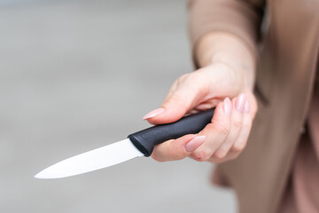 woman cooking on the kitchen with knife
