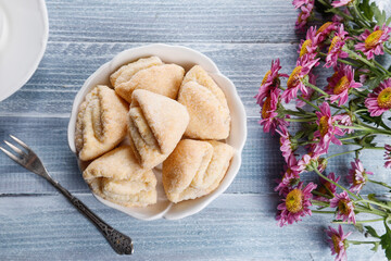 Homemade nut shaped russian soviet cookies and wafer rolls with pastry cream.