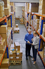 Clipboard, logistics and business people at warehouse with top view planning, teamwork or delivery checklist. Retail, sales or factory team brainstorming compliance, documents or storage solution - obrazy, fototapety, plakaty