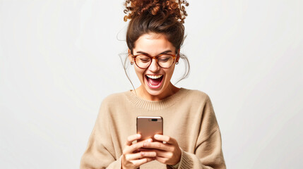 A happy young woman uses her mobile smartphone to read good news online, expressing excitement upon receiving an offer and celebrating success