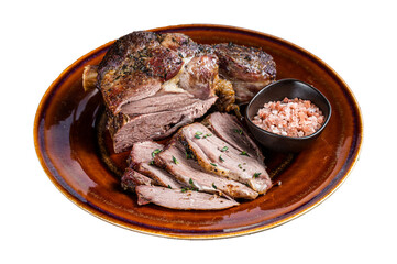 BBQ Roast Lamb mutton leg sliced on a rustic plate.  Isolated, Transparent background.