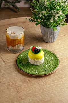 mousse dessert on a plate and coffee in a coffee shop on the tab