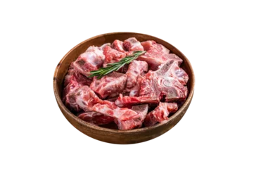 Kissenbezug Fresh Raw meat on the bone diced for goulash in a wooden plate.  Isolated, Transparent background. © Vladimir