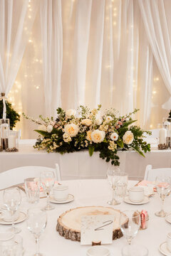 white wedding drapping with twinkle lights and classy bouquet