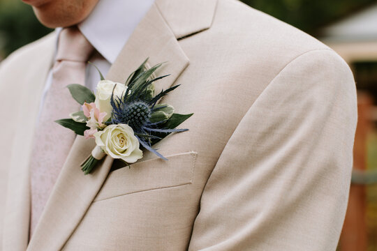 Summer boutonniere on a tan coloured suit