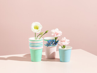 Stacks of beautiful colored disposable cups. Recyclable concept.