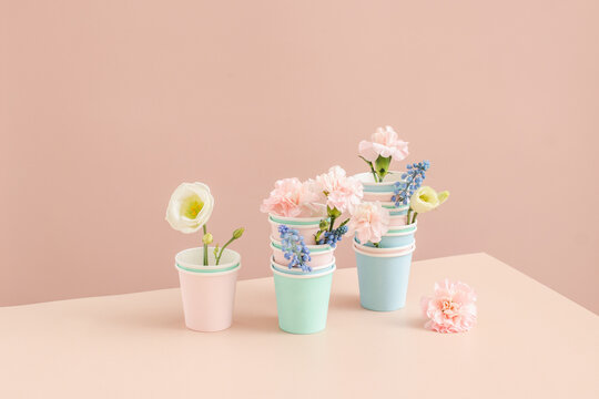 Eco-friendly concept. Stack Of Paper Disposable Cups with flowers