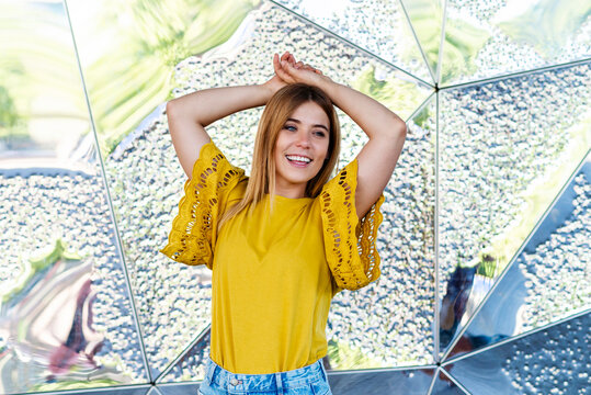 Captivating snapshot of a young woman exuding joy in an urban setting