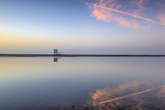 Lifeguard tower on the empty beach at sunrise  in Puerto del Car