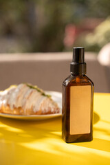beige brown jar bottle of shampoo cream on the sea on the beach in summer