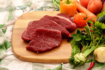 raw beef steak with vegetables