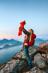 Mother hiking with infant baby outdoor family travel lifestyle in Norway summer vacations in Lofoten islands woman backpacking with child in mountains, love happy candid emotions - Mothers day holiday - obrazy, fototapety, plakaty