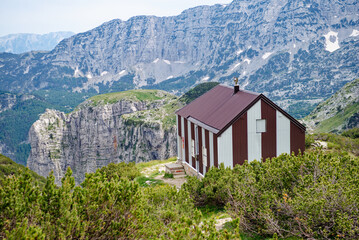 Mountain shelter for hikers and mountaineers on a beautiful mountain range. Alpinism activity....