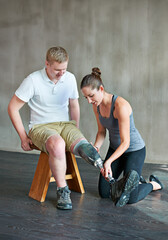 Woman, patient with disability or artificial leg in prosthetic, fitting or training in physio...