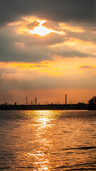 Naklejka premium View of the Dnieper city during a beautiful sunset or sunrise. Warm days in the city. Interesting view. Ukrainian city in 2024. Beautiful sky.