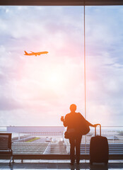 silhouette of woman passenger in airport, travel by flight