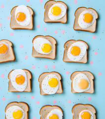 Whimsical setup of toasts and eggs amidst confetti showcasing celebration, Fried Eggs Toast Sandwich, Top-Down View, Pattern Design Wallpaper and Background, Aesthetic Modern Minimal Design Layout	