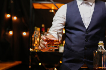 businessmen holding a glass of whiskey