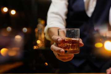 
Bartender pouring Whiskey, on  bar