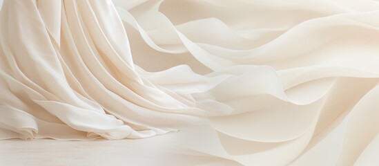 A white cloth billowing in the wind, resembling the light and airy texture of whipped cream or buttercream used in delectable desserts - obrazy, fototapety, plakaty