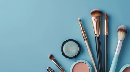 Makeup brushes and cosmetics on blue background. Flat lay, top view. - obrazy, fototapety, plakaty