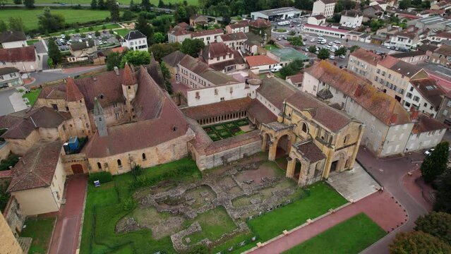aerial view over cluniac site of Charlieu Benedictine Abbey reveling the gothic cloister in Forez, loire department near roanne in france