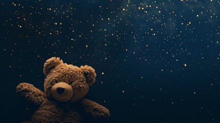 A brown teddy bear sits peacefully in front of a star-filled sky, gazing at the twinkling stars above - obrazy, fototapety, plakaty