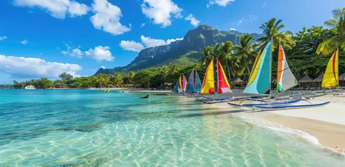 Photo sur Plexiglas Le Morne, Maurice The beautiful beach of Le Morne in Mauritius, vibrant colors, colorful boats and yachts on the white sand, green palm trees, blue sky with clouds, mountain view from the shore
