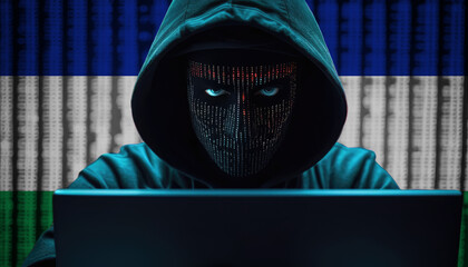 Hacker in hoodie sitting in front of a monitors with Lesotho flag background and  cyber security concept