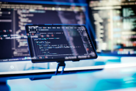 Work from home. Programmer coding code on notebook screen at home.
