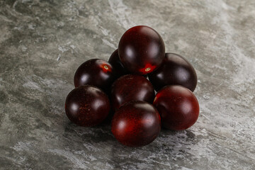 Raw ripe black kumato tomato